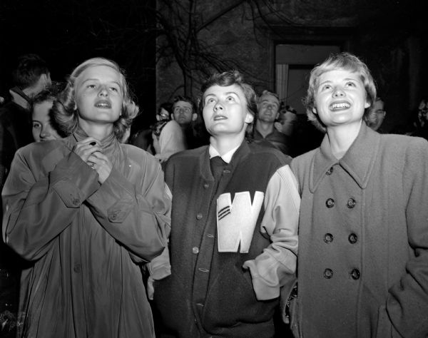 Three residents are observing the fire at Ann Emery Hall, 263-71 Langdon Street. From left are Carole Rathkakmp (Wauwatosa), Sharon Scott (Wauwatosa), and Gloria Lee (Eau Claire).