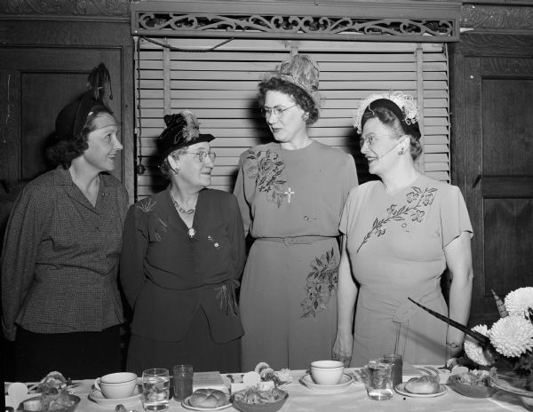 The 15th Anniversary Banquet of the Four Lakes Auxiliary, Number 508, National Association of Letter Carriers. Pictured, left to right, are Mrs. Alexandria Burmeister, Kenosha, state vice-president; Mrs. Eleanore Grosse, president of the Madison group and state organizer; Mrs. Gladys Smits, Green Bay, state president; and Mrs. Helene Lewis, Milwaukee, state treasurer.