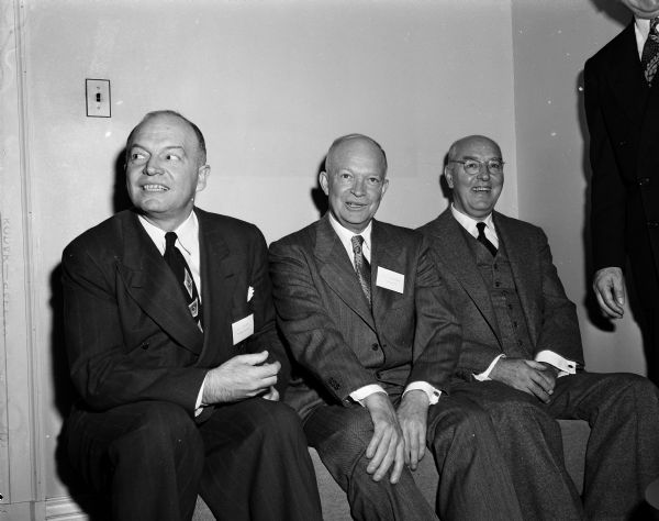 Group portrait of (from left) Harold E. Stassen, president of the University of Pennsylvania; General Dwight D. Eisenhower, president of Columbia University, and Henry M. Wriston, president of Brown University. The three men were in Madison for a meeting of the American Association of Universities, of which Mr. Wriston is president.