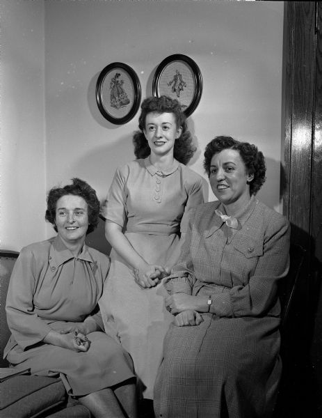 Officers of the newly organized Madison alumnae group of the College of St. Teresa, Winona, Minnesota. From left are: Mrs. William (Margaret) Schmitz, vice-president; Kathleen Link, secretary-treasurer; and Alice Fox, president.