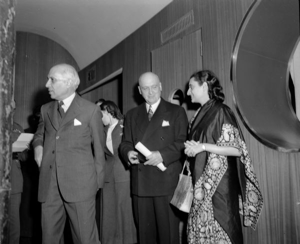 Indira Gandhi, daughter of Prime Minister Pandit Jawaharlal Nehru of India, speaking with University of Wisconsin President E.B. Fred inside Memorial Union. Nehru was in Madison to speak at the Memorial Union.