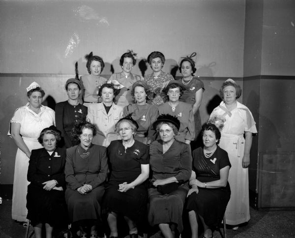 Group portrait of fifteen of the rangers and officers from Madison courts of the Women's Catholic Order of Foresters who assisted at the formal installation rites of the Our Lady Queen of Peace court.
