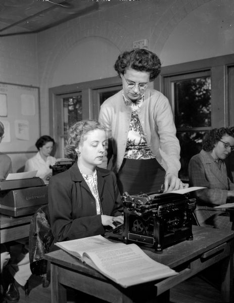 Doris Trameri of 568 Park Lane, previously diagnosed with tuberculosis, brushed up on her typing and attended other classes in shorthand and bookkeeping which Lake View sanatorium features as part of its rehabilitation program. She is pictured with Mabel Bloxham, instructor for the typing and accounting classes.
