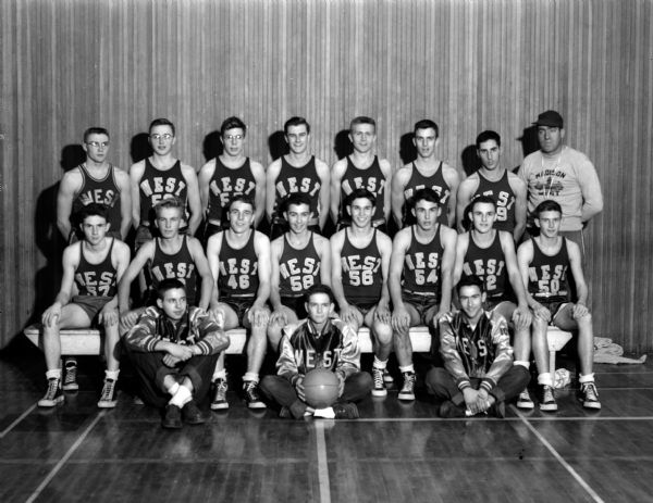 Group portrait of West High School boy's basketball team with Coach Bob Harris.