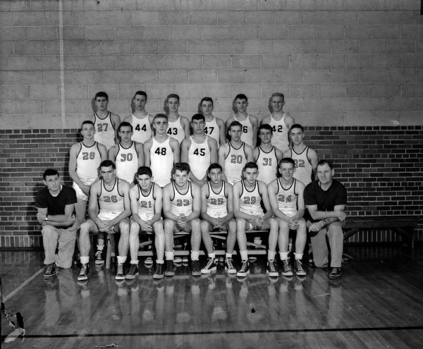 Group portrait of Edgewood High School boy's basketball team with Assistant Coach Tom Bennett and Coach Earl Wilke.