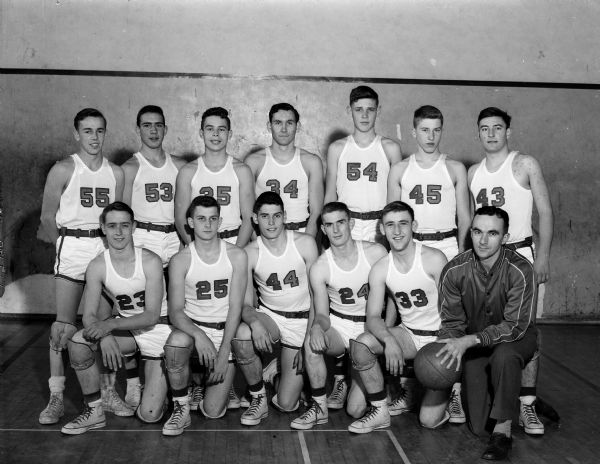 Group portrait of Wisconsin High School boy's basketball team with coach Harold Metzen.