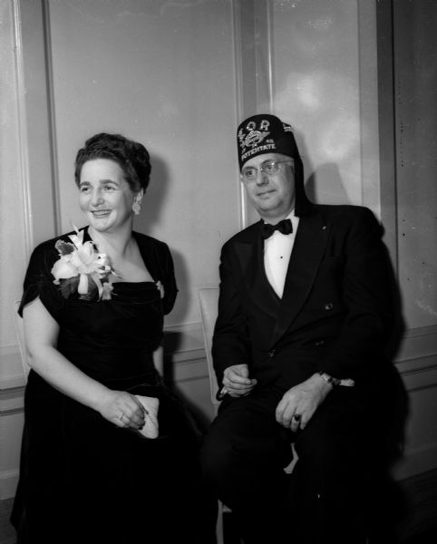 Mr. and Mrs. Rufus F. Wells pose for a portrait as guests of honor at the Zor Shrine Potentates' Ball held at the Hotel Loraine. Mr. Wells is head of the Zor Shrine.