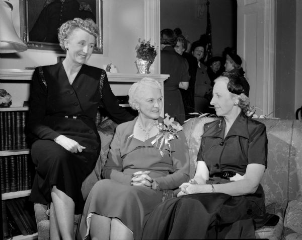 Mrs. Oscar Rennebohm hosts shriners' wives at a tea party at the executive residence. Shown with Mrs. Rennebohm are Mrs. Gordon (Mabel) Nelson, left, and Mrs. Arthur F. (Madelyn) Trebikock, right.
