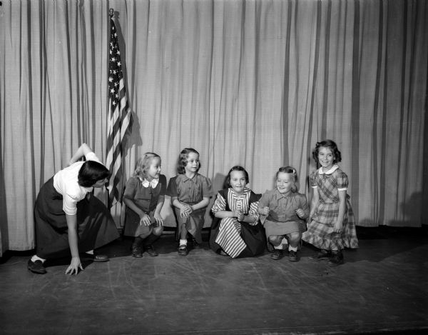 University of Wisconsin recreation student Barbara Burrell teaches Brownies to play "Duck, Duck, Goose." Shown are Dudgeon School Brownies Troop 102: Marilyn Johnson, Susan Main, Wendy Sue Woerdelhoff, Susan Christianson, and Patty Patterson crouching as the leader calls the key word, "Goose."
University of Wisconsin recreation students are available to lead varying activities for groups through a service bureau they have established.