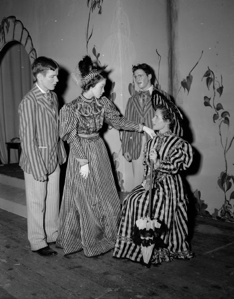 West High School students in costume for "Charley's Aunt." Left to right: John Lovell, Joan Miles, Bob Carpenter and Mimi Mackin.