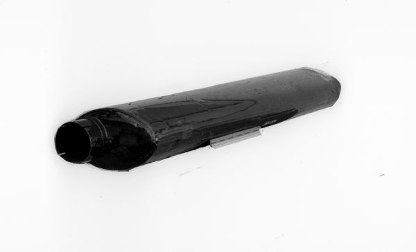 One of several photographs of mufflers manufactured by Nelson Muffler Company in Stoughton. In one of the photographs, a box is shown addressed to C.C. Herling Company, 2947 University Avenue in Madison.