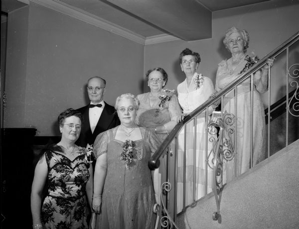 Dignitaries pose on a staircase at a banquet at the Masonic temple given by the Monona chapter of the Order of the Eastern Star to honor Mrs. Leon W. (Sayda S.) Pettersen. Pettersen is worthy grand marshal of the general grand chapter of OES. From left to right are: Mrs. Pettersen; Ivan Gibson, worthy patron of Monona chapter; Mrs. Abbie Hanson, Indiana; Mrs. Bernie Pulk, Tenn.; Mrs. Mary Swafford, worthy matron of Monona chapter; and Mrs. Lettie Dickey, Indiana.