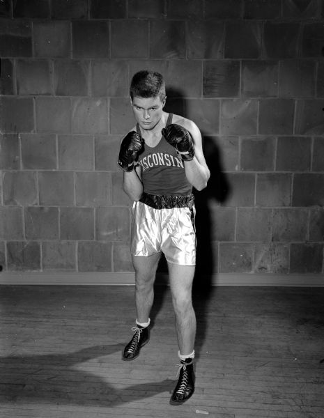 One of three University of Wisconsin boxers entered in the sixteenth annual Tournament of Contenders held at the University of Wisconsin fieldhouse. Individual portraits are of Jack Marsh, a 135 pounder from Green Bay; Ted McNeal, a 145 pound African American from Milwaukee; and Andy Mailer, a 155 pounder from Madison.