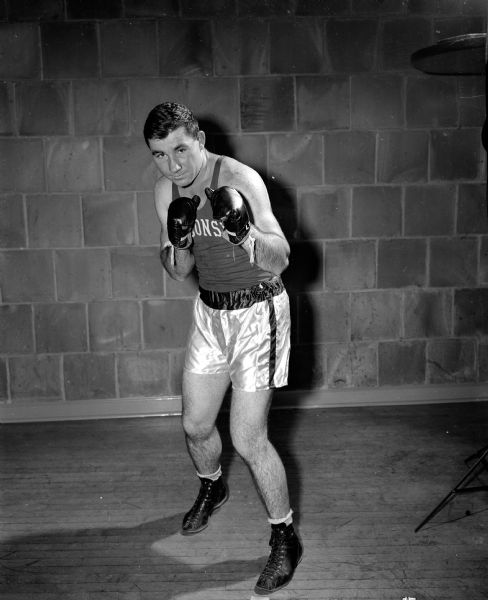 Portrait of Gerald Meath, one of two University of Wisconsin boxers who met for the heavyweight championship of the sixteenth annual Tournament of Contenders held at the University of Wisconsin fieldhouse. Meath from New Richmond faced Gordon Kowing of Madison.