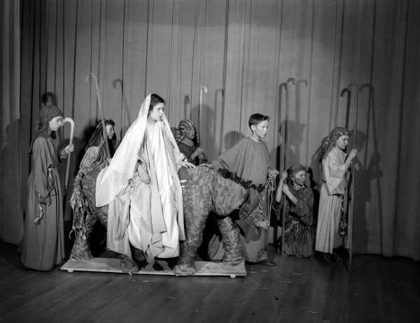 Lapham School Nativity play "Small One" is an yearly student Christmas production. "Mary" was played by Jean Loy, 943 East Dayton Street, rode Small One (donkey), Joseph, led by Donald Hackbart. Shepherds they passed along the way are: Billy Reynolds, 130 North Blair Street, Richard Freund, 1155 Sherman Street, Jimmie Fillner, 119 North Ingersoll Street, and Robert King, 17 North Brearly Street.