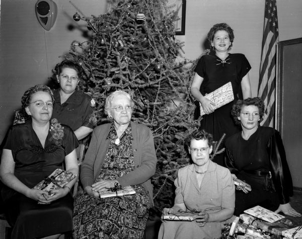 Women of the Moose Lodge brought gifts to a party at the Lodge to be sent to "Moosehaven" in Miami, Florida. Pictured are, left to right: Mrs. Edith Meier, Mrs. Edna Hanson, Mrs. Marietta Hering, Mrs. Beatrice Murray, Mrs. Esther Anderson, and Mrs. Cora Sannes.