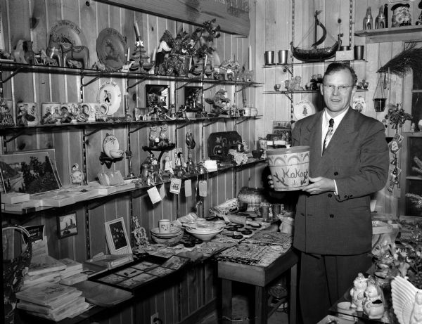 Ralph Jacobs looks over some of the exotic merchandise in his gift shop on County Highway PB in the town of Verona.