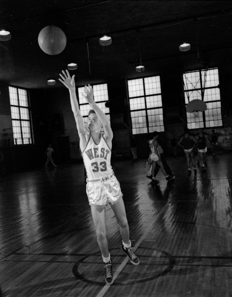 One of thirteen negatives of individual West High School Boy's Basketball players including #33 Tom Mack, #42 Jim Clapp, and #35 Bill Marshall.