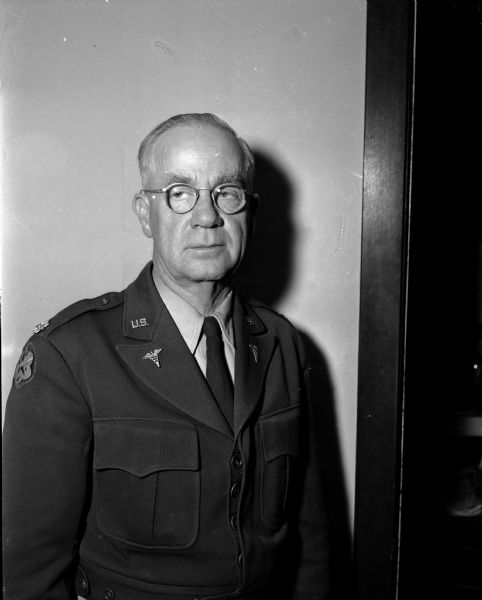 Shown in uniform is Lieutenant Colonel H. Curtis Johnson who was a medical doctor in Madison prior to 1941. He served eight years in the army medical service. During the war, Colonel Johnson served as "sort of a family doctor" to Gen. Douglas MacArthur's wife and son, Arthur, as well as other war time and post war duties in the Far East.