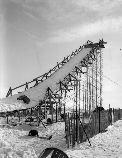 Front view of the jumping scaffold at the Blackhawk Ski Club ski jump at Tomahawk Ridge, located west of Middleton. Snow was carried up the ramp in bushel baskets to cover the surface.