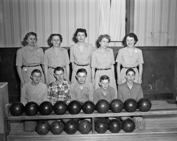 Mother and son bowling match. L to R back row: Mamie Zander; F. "Babe" Faust; Vi Brumm; Bernie Esser; Millie Adler. L to R front row: Neal "Peewee" Zander; Tom Faust; Roger Brumm; Wayne Esser; "Buck" Adler.