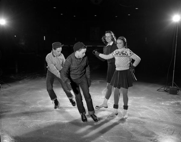 Four members of the Madison Skating Club's Junior Club are shown on the ice. They are, from left to right, Ray White, Jeff Blume, Sally Williamson, and Jean Sorum.