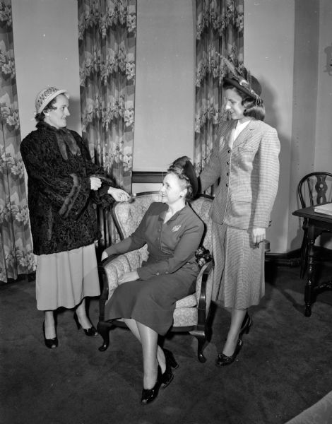 Three of 15 models who will display play dresses, hats, coats, suits, robes and evening gowns at the meeting of the University Extension League are, from left to right: Mrs. L. J. (Thelma) McQuown, Mrs. R.A. (Elinore) Black, and Mrs. J.R. (Mary) Collins.
The style show will be presented by the homemaking department of the Vocational and Adult Education School.