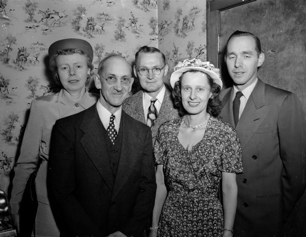Five past-presidents of the Madison Come-Back Club at an annual dinner. Left to right: Myrtle Tiffany, Jay Rose, Lloyd Lock, Frida Kaech and Bjarne Romnes. They participated in a ceremony of blowing out candles on a birthday cake to signify a return to health from tuberculosis.