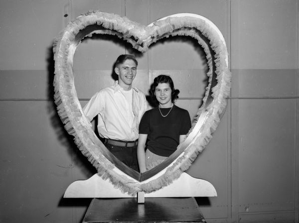Portrait of LOFT jitterbug competition champions Donna Armstrong and Steve Gust in a large Valentine heart "frame."
