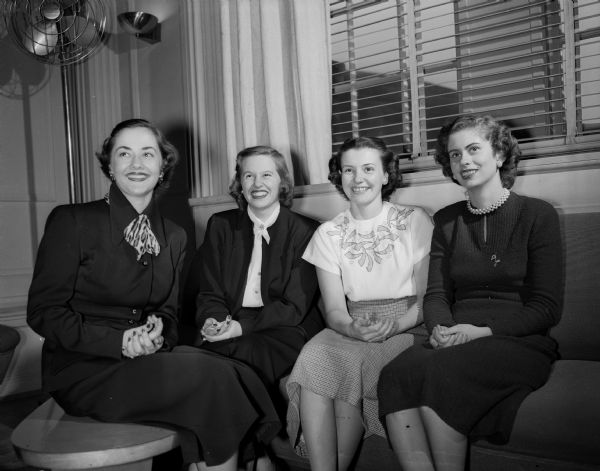 Four of the Dames club officers are shown, left to right: Mrs. Ben (Constance) Shefchik, 417 W. Dayton St., corresponding secretary; Mrs. William (Anne) Haley, 131 Langdon St., first vice-president; Mrs. Wayne (Betty) McKibbin, 433 W. Gilman St., second vice-president, and Mrs. Robert (Evelyn) Gunderson, 509 N. Lake St., president.