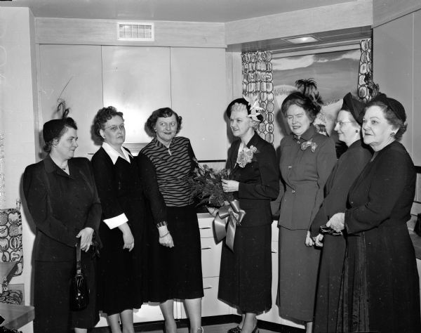 Mrs. Oscar (Mary) Rennebohm, wife of Wisconsin's governor, presided at the formal unveiling of the St. Charles steel unit kitchen, at 548 West Washington Avenue. Also present at the unveiling ceremony were many leading home economists of the city. They included Miss Helen Cramer, assistant professor of home economics at the University of Wisconsin; Miss Winifred Layden, supervisor of the home economics department at the Madison Vocational and Adult Education school; Miss Josephine Pollock, assistant state leader of home economics extension work; Miss Loreen Jacobson, home economics director of the Wisconsin Power and Light Company, and Mrs. Luella Mortenson, home economics expert of radio state WKOW.