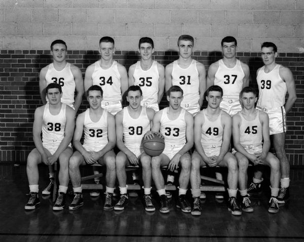 Group portrait of 12 uniformed members of the Edgewood boy's basketball team.
