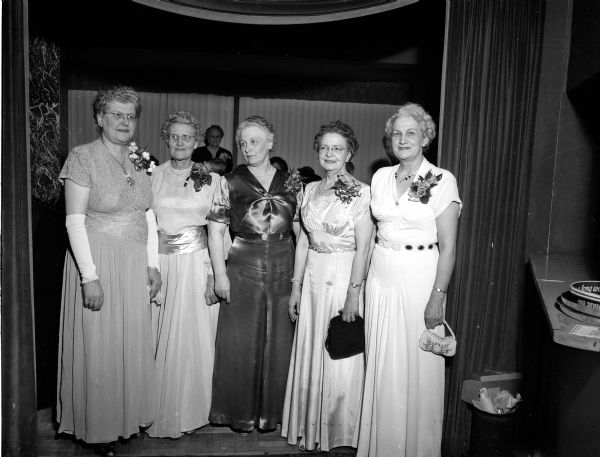 Some of the women who worked on the arrangements for the Daughters of Norway Fremsyn Lodge No. 53 Thirty-Fifth Anniversary Banquet pose for a group portrait at the Edgewater Hotel. From left are: Mrs. Esther Hanson, Milwaukee, supreme trustess of the national organization and president of the Lyngblomsten chapter of Milwaukee; Mrs. Charles, pianist for the Fremsyn lodge; Mrs. Arthur Thompson, general banquet chairman; Mrs. Nels (Selma) Ylvisaker, president of Fremsyn lodge; and Mrs. Sverre Solberg. vice-president of the Fremsyn lodge.