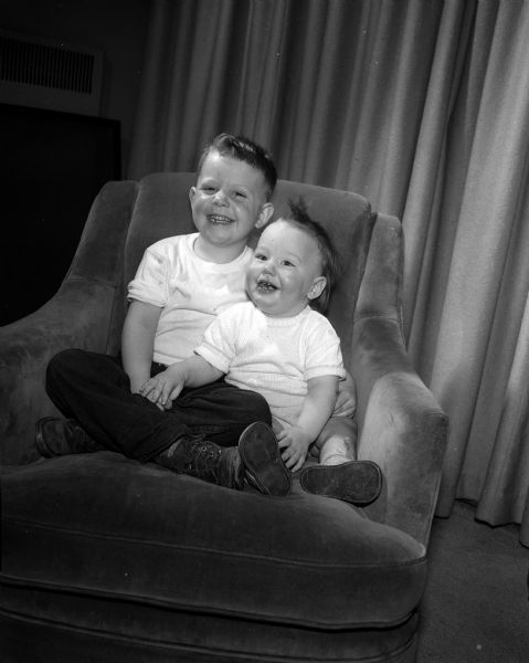 'Tis Irish they are for sure, begorra, these young lads, five-year old Richard, left, and his eleven-month old brother, Patrick, right. The boys are the sons of Mr. and Mrs. Richard T. (Doris) Keeley, Jr., 3414 Lake Mendota Drive.