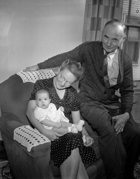 Children in Foster Care. Henry and Ella Ellestad with "Sister," a 4 month old baby, their seventh foster child.