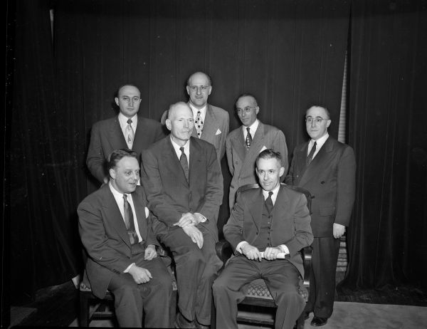 Group portrait of participants in a ceremony to dedicate the site of the Hillel foundation student center, which was part of the 25th anniversary of the Foundation at the University of Wisconsin. Seated left to right: Arthur Lelyveld, national director of the B'nai B'rith Hillel foundations, New York City; the Rev. George Collins, pastor of the Baptist Student House; and the Rev. Cecil Lower, Presbyterian Student Center. Standing left to right: Rabbi Max Lipshitz, Congregation Agudas Achim; Rabbi Theodore H. Gordon, Philadelphia, former Hillel director at the university; Harry Epstein, master of ceremonies; and Rabbi Hyman Krash, Congregation Adas Jeshurun.