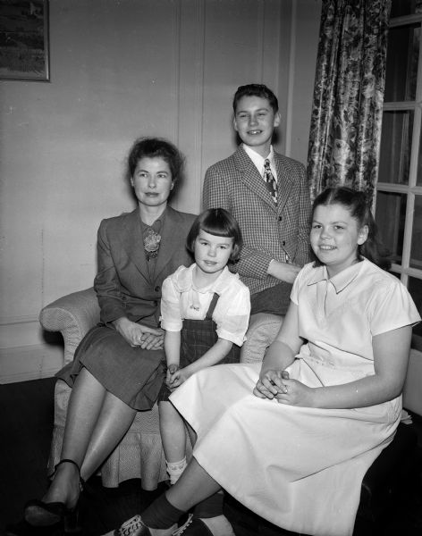 The family of the Reverend John H. Keene arrived with Reverend Keene as he took up his duties as Rector of Grace Episcopal Church. Pictured are Mrs. Katherine B. Keene, wife of Rev. John H. Keene, with the couple's three children: John, age 14, who attends West Junior High School; Peggy, age 12, and Karen, age 5, both of whom are pupils at Randall School.