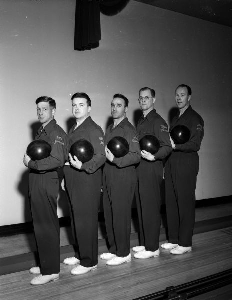 Five men from the Madison Brass Works Bowling Team pose for a group portrait. They are, from left to right, Earl Zanoya, Billy Dye, Steve Caravella, Harry Helman, and Harry Vogts.