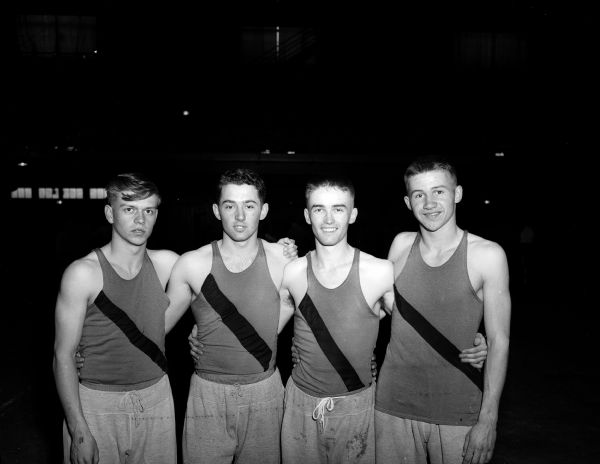 The Richland Center sprint medley relay team poses for a group portrait at the West High School relays.  They are, from left to right: Wayne Lewis, Ken Johnson, Glen Davison and Verlin Braithwaite.  This team captured the Class B event.