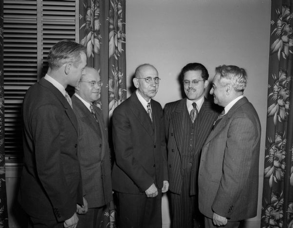 Saul Kasdin, a long-time member and first president of the Madison Zionist district, was honored at a dinner meeting of the group at the Capitol Hotel. He plans to visit a brother in Israel he has not seen for 68 years. Shown (left to right) are Louis M. Rapoport, Zionist district president; Herman Halperin; Kasdin; Rabbi David Shapiro; and professor Selig Perlman of the University of Wisconsin economics department, guest speaker.