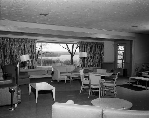 Interior view of the lounge in the newly completed $66,000 addition to the Blackhawk Country Club, whose large picture windows overlook Lake Mendota. The new furniture is valued at more than $5,000.