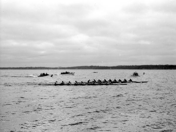 Rowing crew race on Lake Monona between freshman crews of the University of Wisconsin and Columbia.