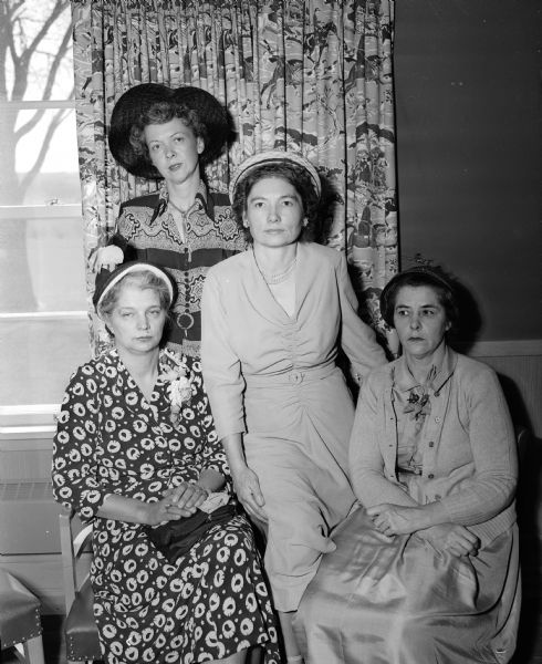 Group portrait of the officers of the Shorewood Hills League elected at the annual spring party at the Blackhawk Country Club. Seated, left to right, are Mrs. Russell T. (Genevieve) Gregg, past president; Mrs. Ralph (Dorothy) Benedict, past vice-president; and Mrs. Llewellyn (Margaret) Cole, general chairman of the party. Standing is Mrs. Fred C. (Irene) Dettloff, the new president.