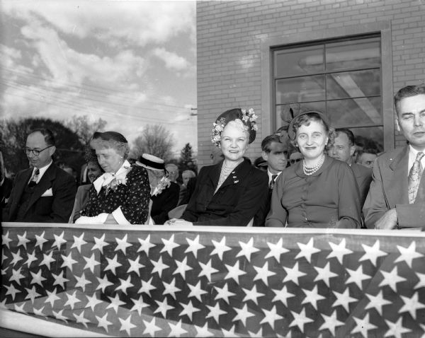 Accompanying President Truman on his visit to Madison are the First lady, Mrs. Harry (Bess) Truman and their daughter, Margaret, pictured here at the ceremonies of the CUNA dedication at Filene House, 1617 Sherman Avenue. Mrs. Truman, left, sat with Mrs. Oscar (Mary) Rennebohm, center, wife of Governor Rennebohm, on the right, Margaret Truman, and Mrs. John Eidam, seated behind Mrs. Truman, who accompanied the presidential party to Grace Episcopal Church.