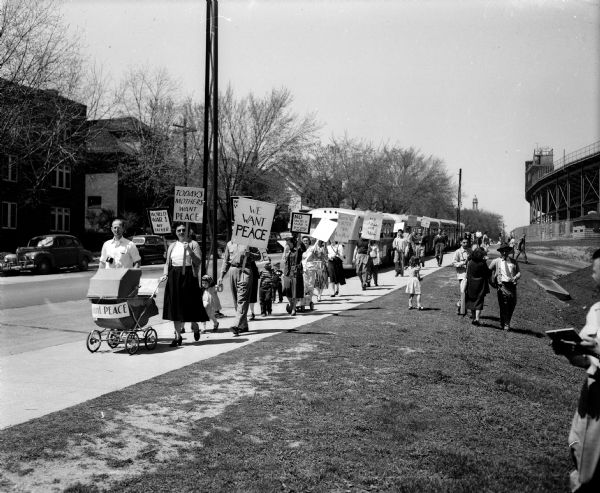 A peace demonstration was present on Breese Terrace, Regent Street, Little Street and Monroe Street as President Truman arrived for a speech at the Field House on Sunday afternoon. It was composed of a group of unidentified men, women and children carrying signs with war protest messages. ROTC members who were present said the protesters had attended an ROTC program recently. The marchers were unwilling to give their names to the police.