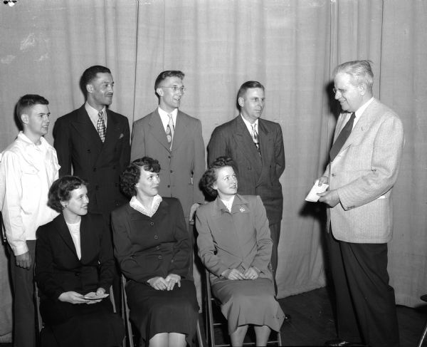Seven Madison Vocational and Adult Education school students who received awards for "exceptional records in attendance, achievement and effort" at the school's annual Achievement Day program pose for a portrait. Seated, from left, are Beverly Sime, Beulah Small, and Helen Jochman. Standing, left to right, are Charles MacLeod, Hosea Doxey, James Lauridsen, and Kenneth Callahan.