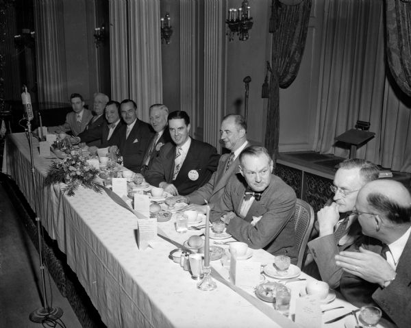 Six of the people at the speakers table for the Madison Advertising Club's "Bosses Night" dinner at the Hotel Loraine. From left are Karl Eisele, club president; Lionel Moses, Chicago, vice-president of Parade magazine; Bernhard F. Mautz, Jr., president of Mautz Paint and Varnish Company; Don Anderson, publisher of the <i>Wisconsin State Journal</i>; Arthur H. "Red" Motley, New York, president and publisher of Parade magazine and guest speaker; and Robert Jones, past-president of the club. Four unidentified men are on the right at the table.