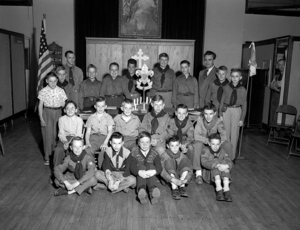 Group portrait of members of the Boy Scout Troop 19 of the Luther Memorial Church with their scoutmaster, Jack Gasdorf, and Reverend A. Henry Hetland, director of the Wisconsin Lutheran Student Foundation.