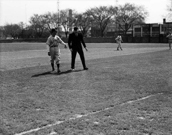 This was Coach Ray Fisher's only appearance on Breese Stevens Field Saturday morning when his Michigan baseball team received its second straight setback at the hands of Wisconsin. This was the first inning after the Badgers' Sheldon Fink stole second. Umpire Russell Welch told Fisher in strong language to get off the field and the latter did not come back out during the rest of the game.