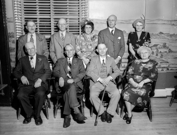 Nine retiring non-faculty employees of the University of Wisconsin that were honored at the annual Employee's Recognition Ceremony at the Memorial Union. In the front row, left to right, are: Herman Moen, Henry Roberts, William Gift, and Mrs. Fannie J. Bashford. In the back row, left to right, are: Lewis E. Jones, Karl N. Booth, Sylvia K. Behnke, Joseph N. Berg, and Hannah C. Peterson.